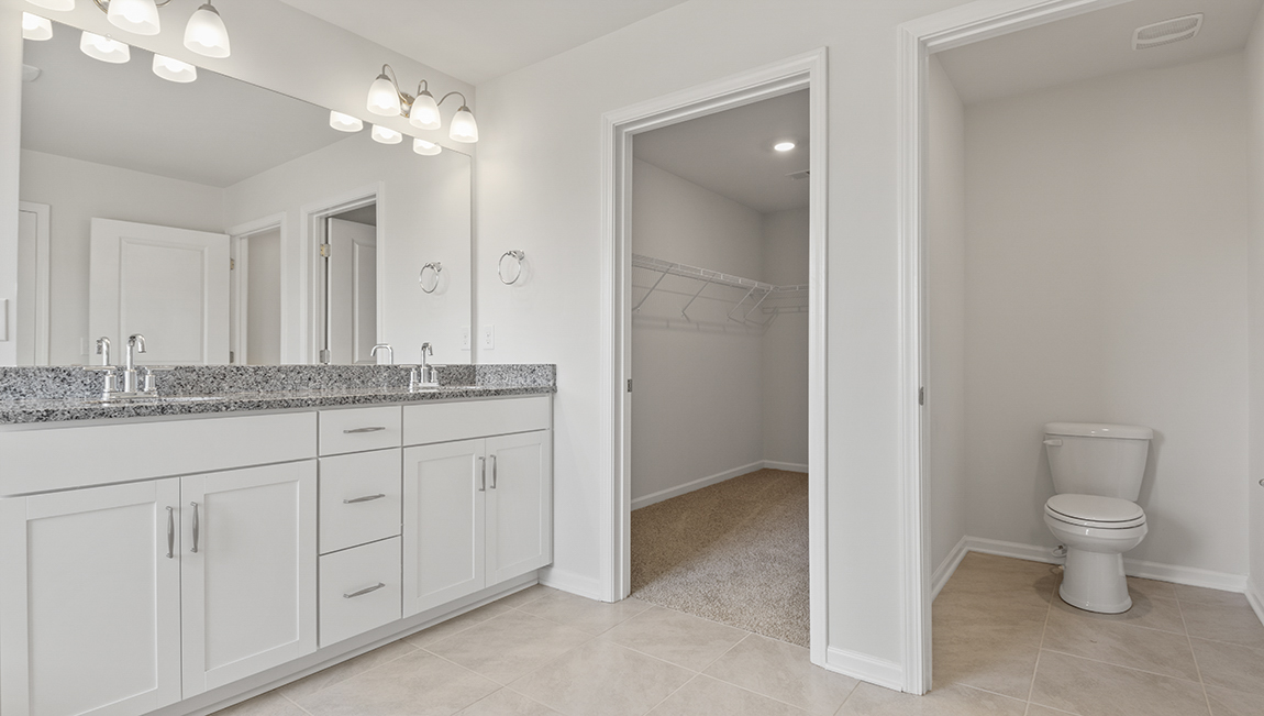 Primary bathroom with soaking tub, and wlak in shower with bench