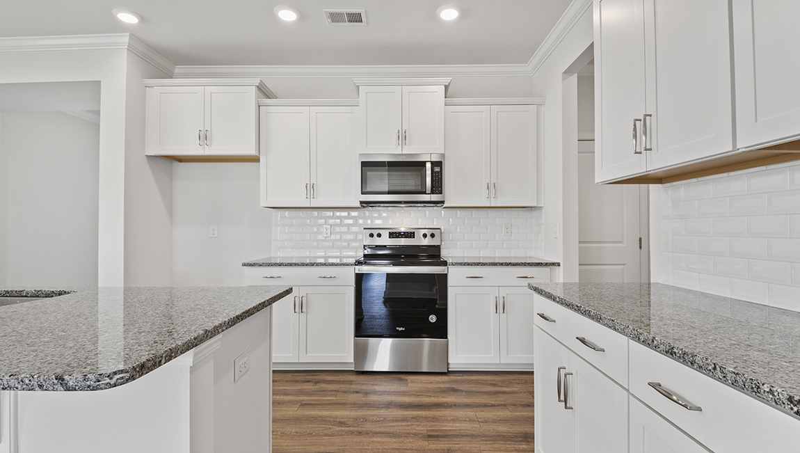 Kitchen and island with stainless steel appliances