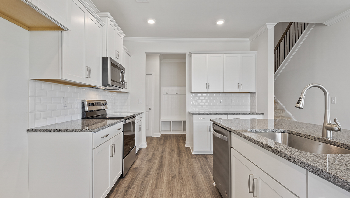 Kitchen and island with stainless steel appliances