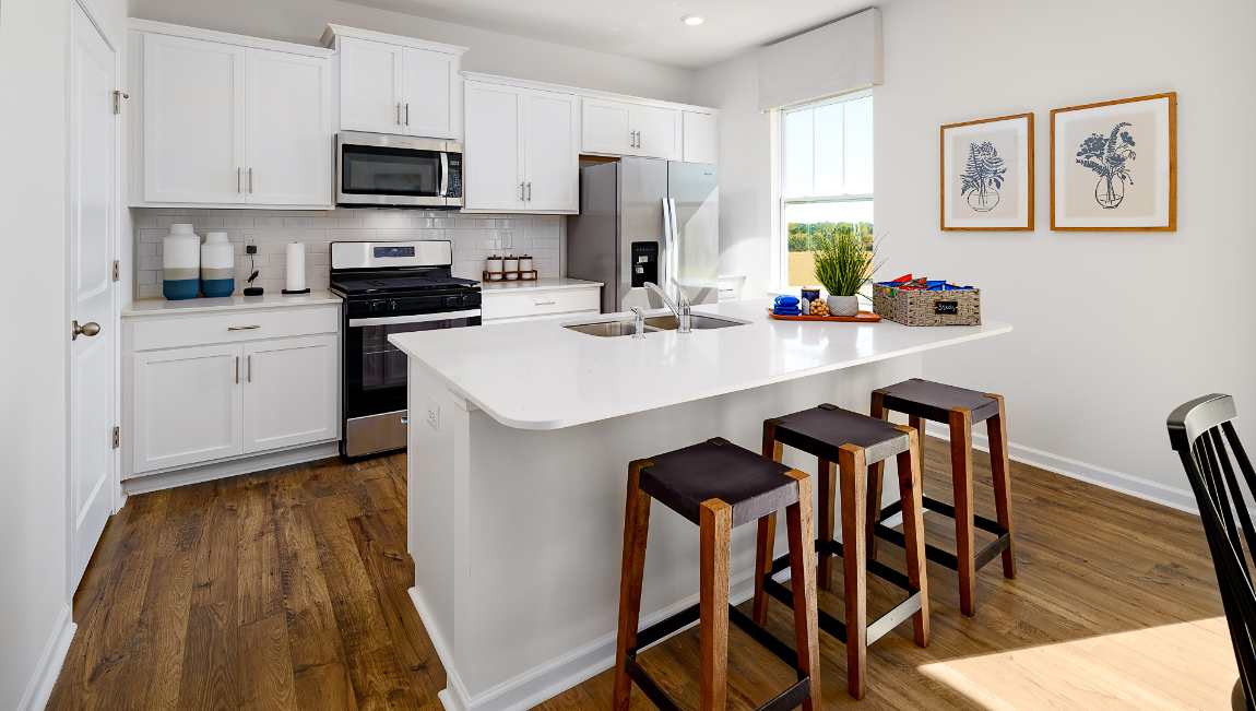 Kitchen and island with stainless steel appliances