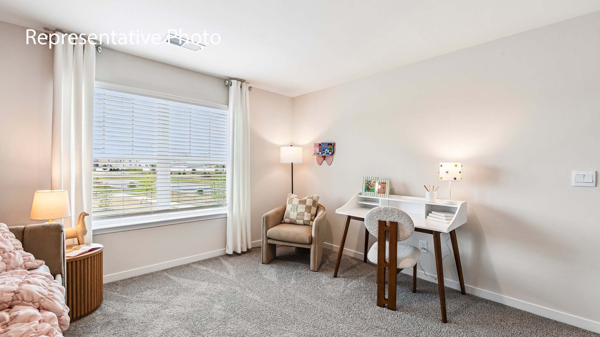 carpeted bedroom with large window
