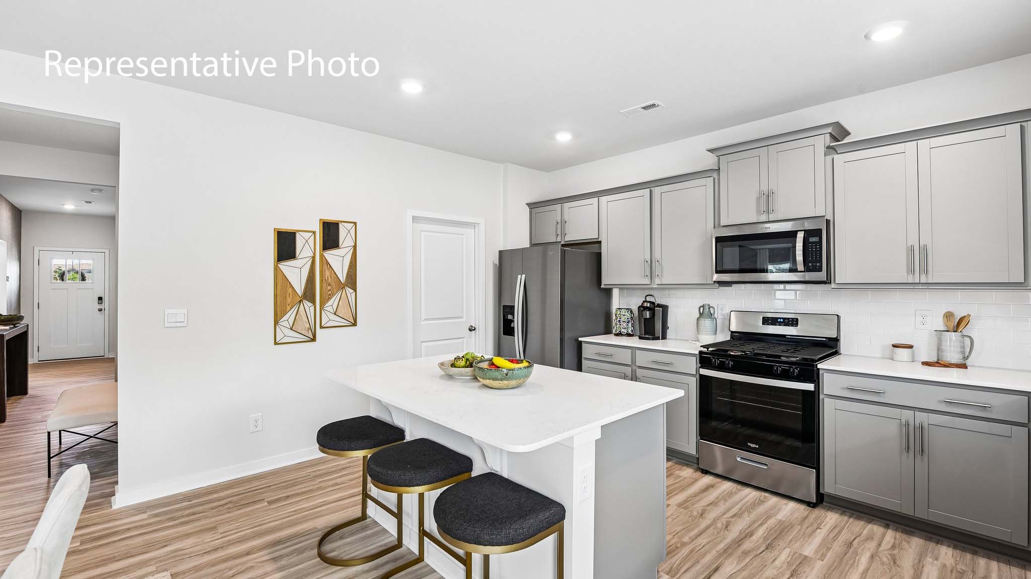 kitchen and island with stainless steel appliances