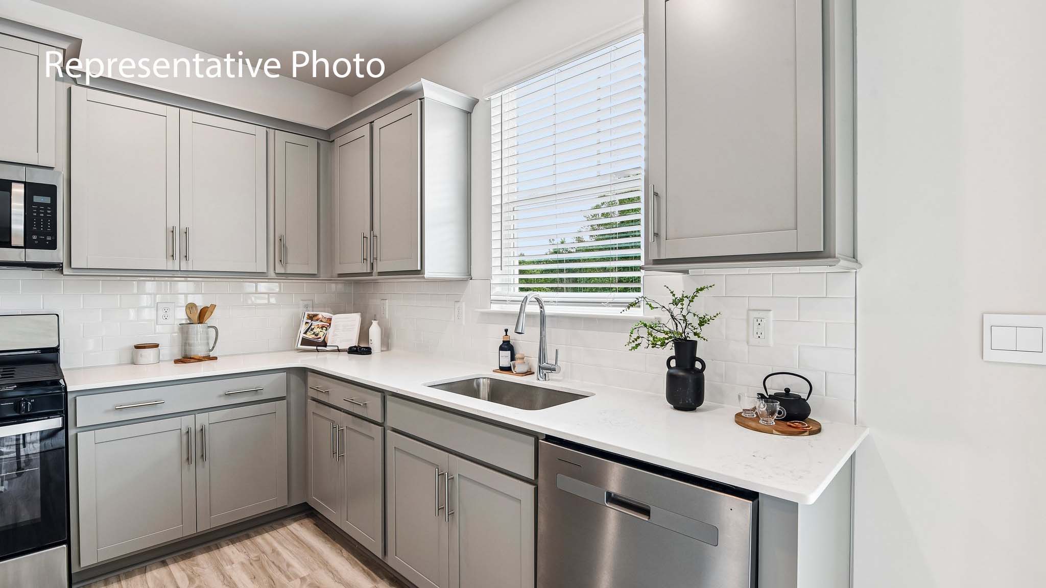 kitchen and island with stainless steel appliances
