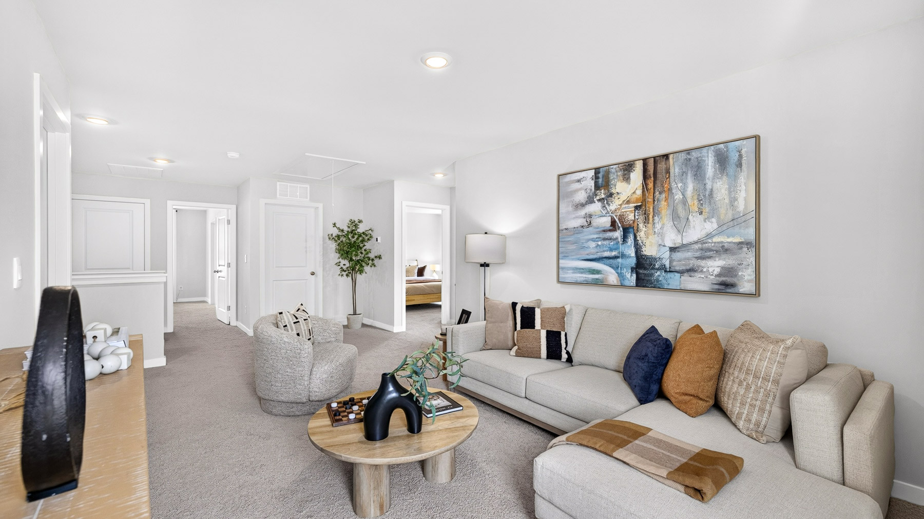 Upstairs carpeted loft with view of stairs