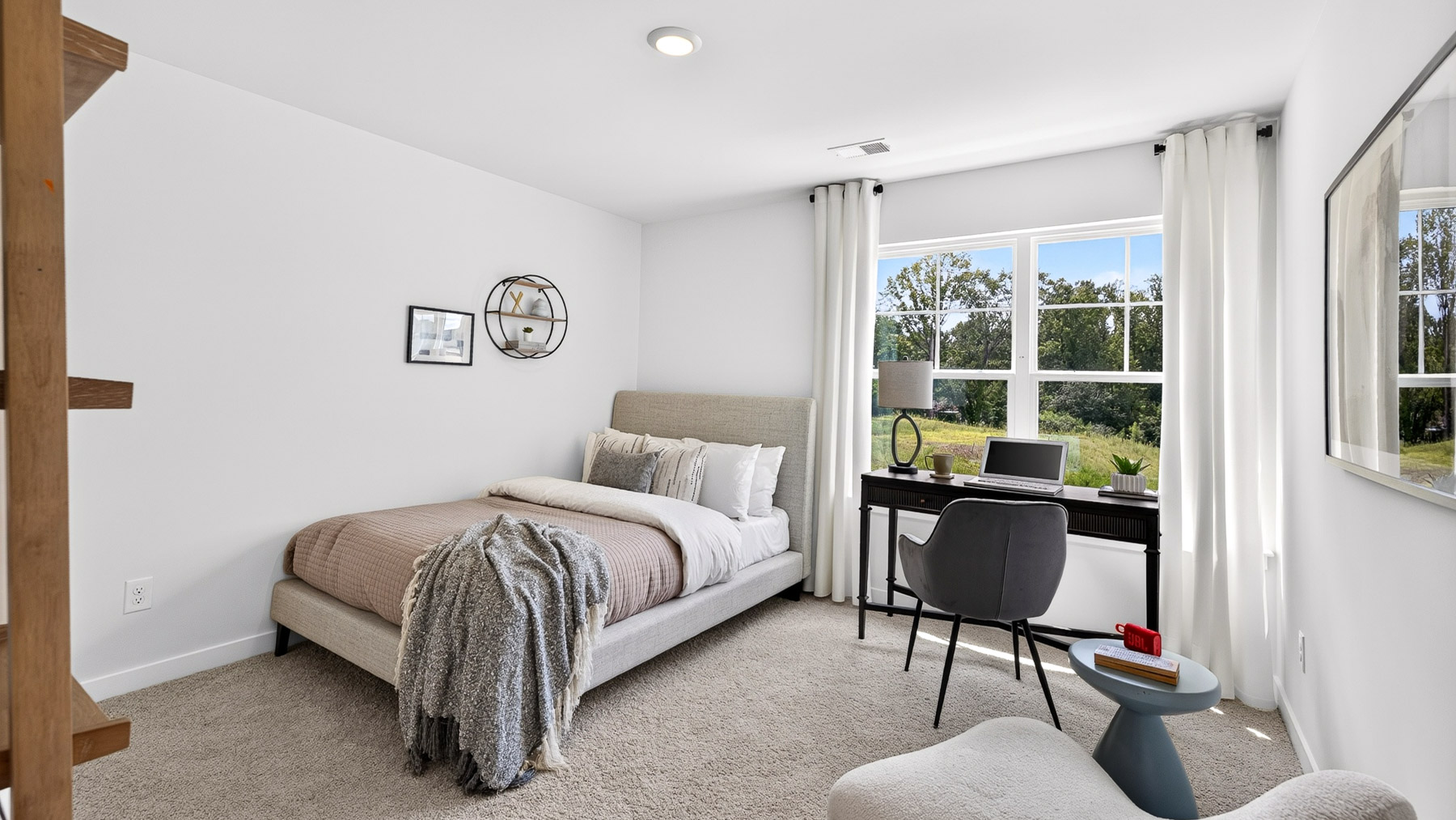 Carpeted bedroom with windows