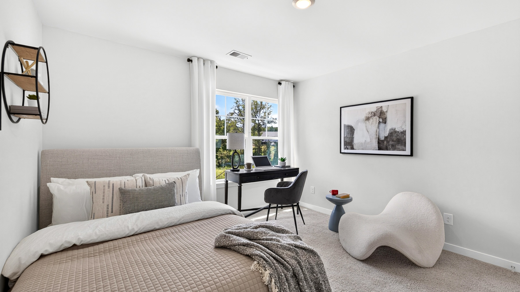 Carpeted bedroom with windows
