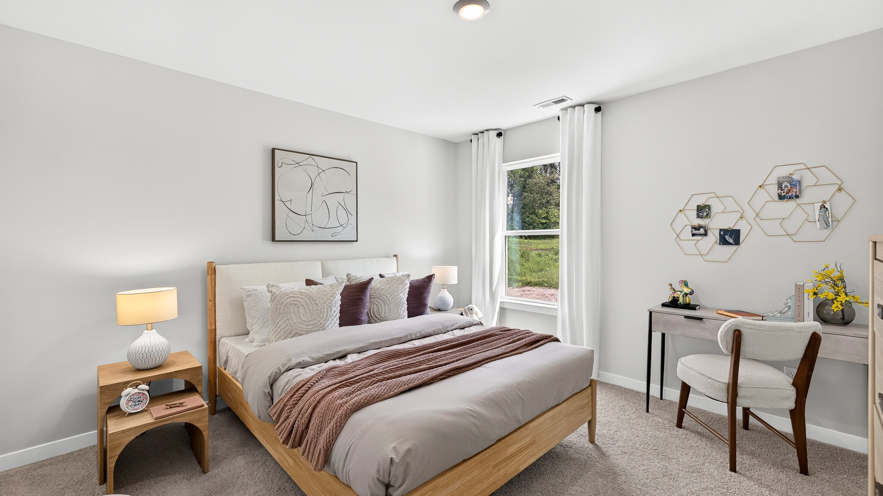 Carpeted bedroom with windows