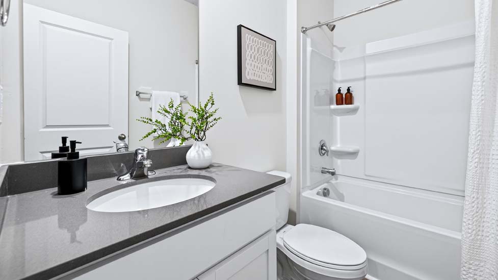 bathroom with bathtub shower combination