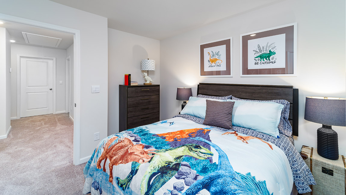 Carpeted bedroom with large window