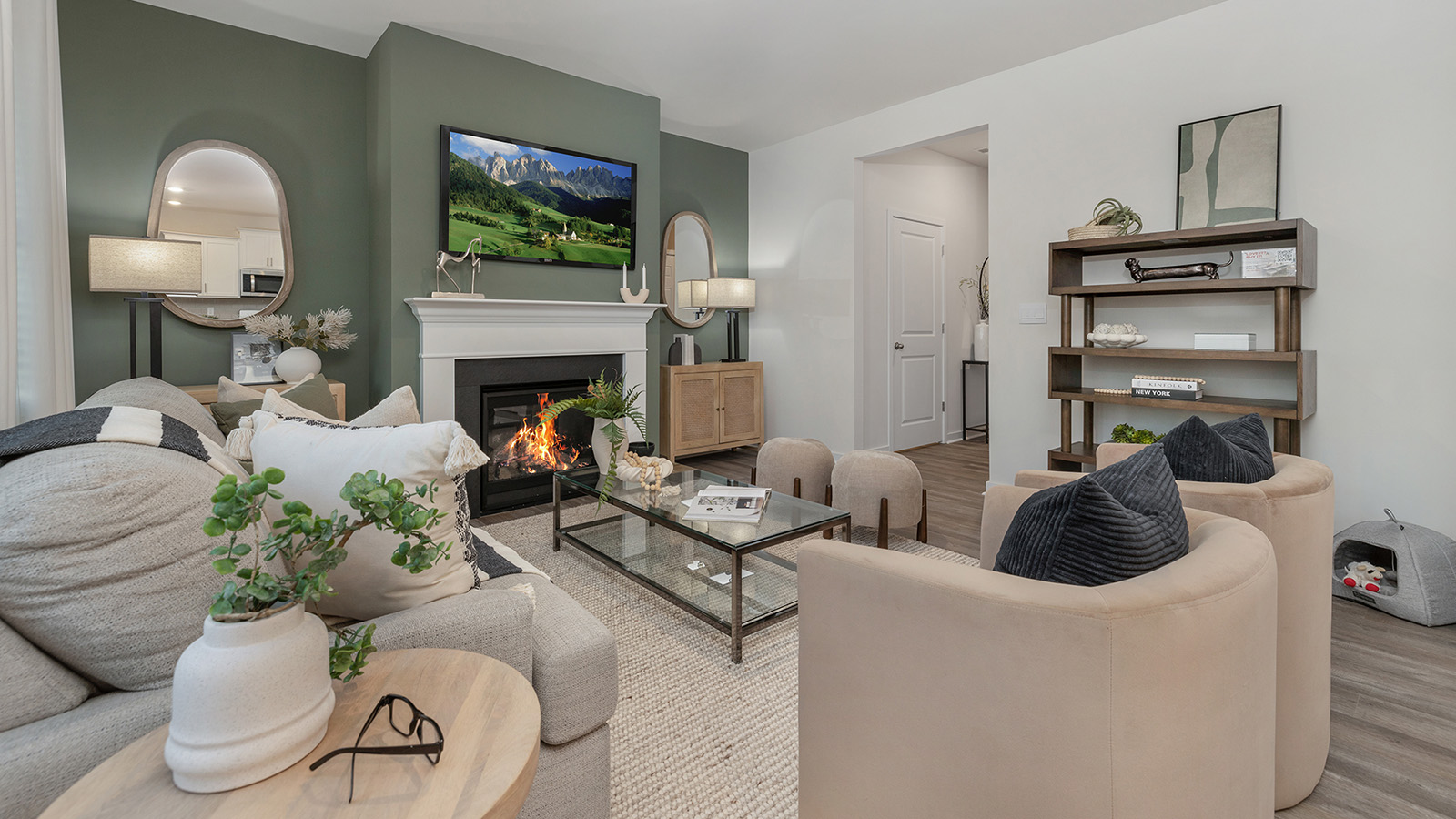 Open concept living area near kitchen and dining area with fireplace and large windows