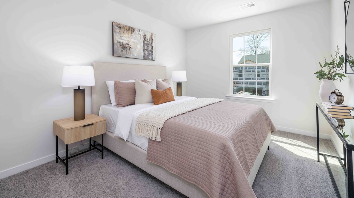 Carpeted bedroom with window