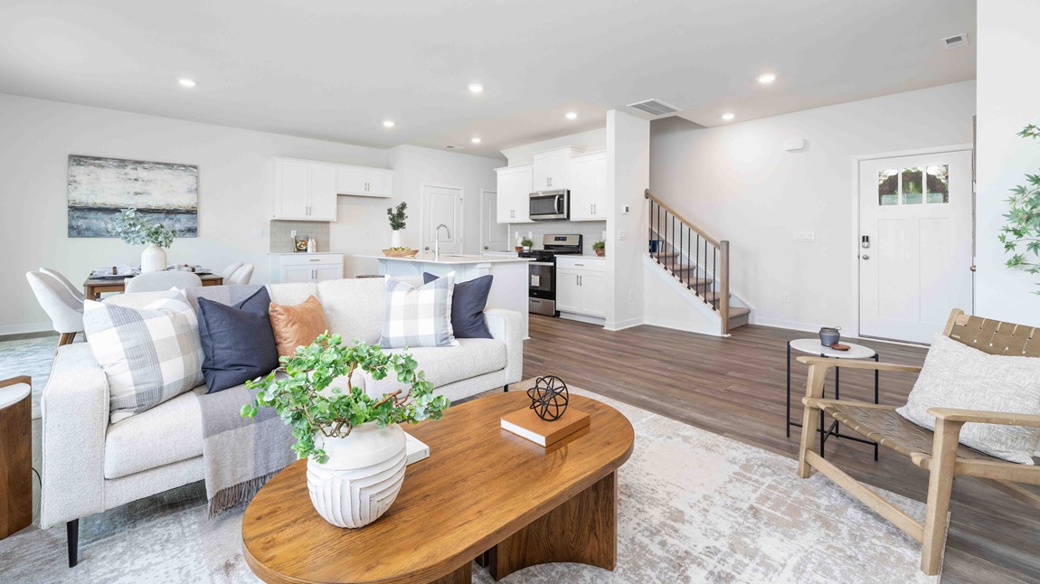 Spacious family room with large windows and fireplace