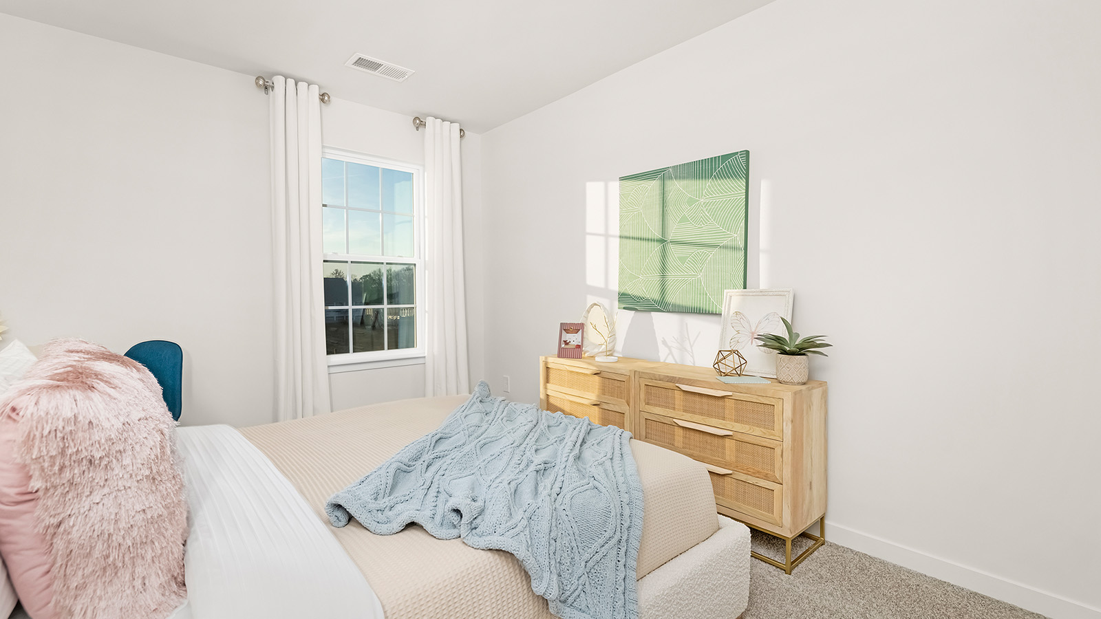 Carpeted bedroom with windows