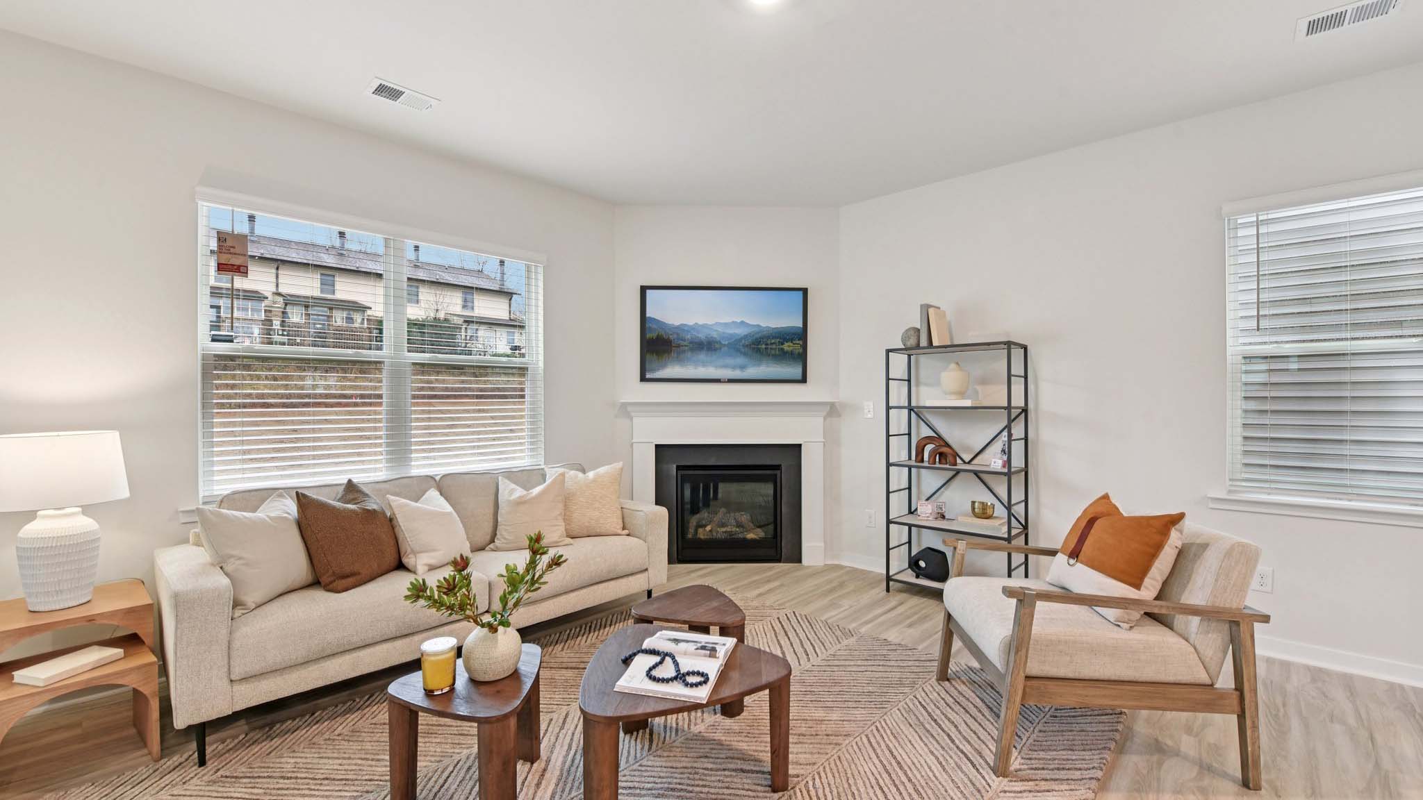 Spacious family room with windows and fireplace