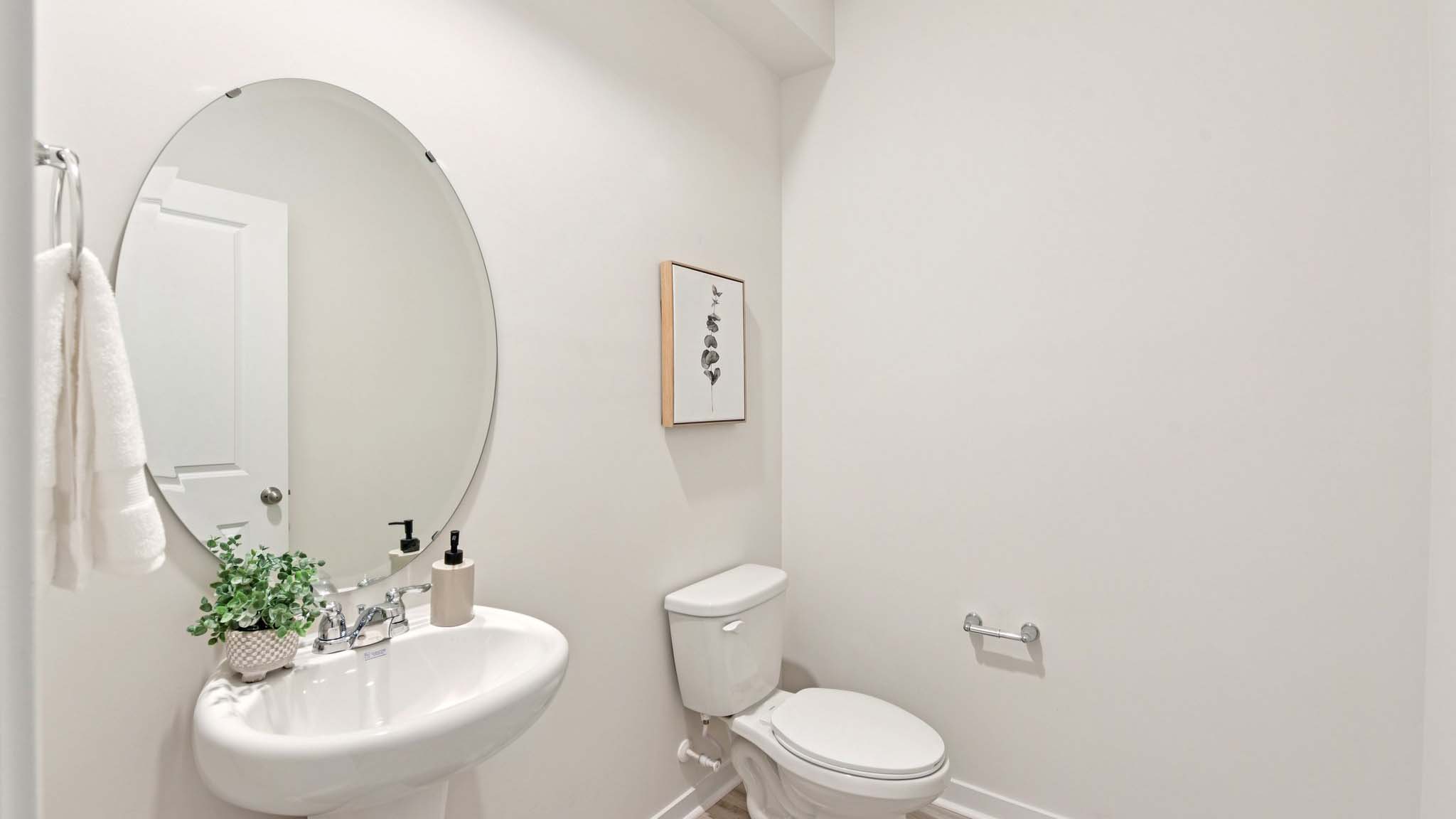Powder bathroom with small sink and toilet