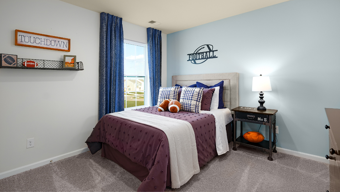 Carpeted bedroom with large window