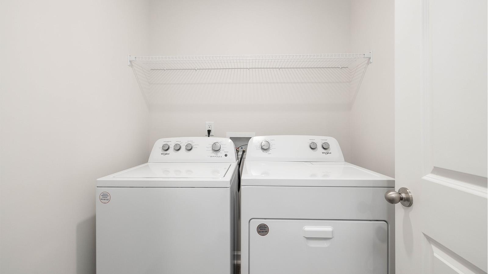 Laundry room with built in hanger and storage racks