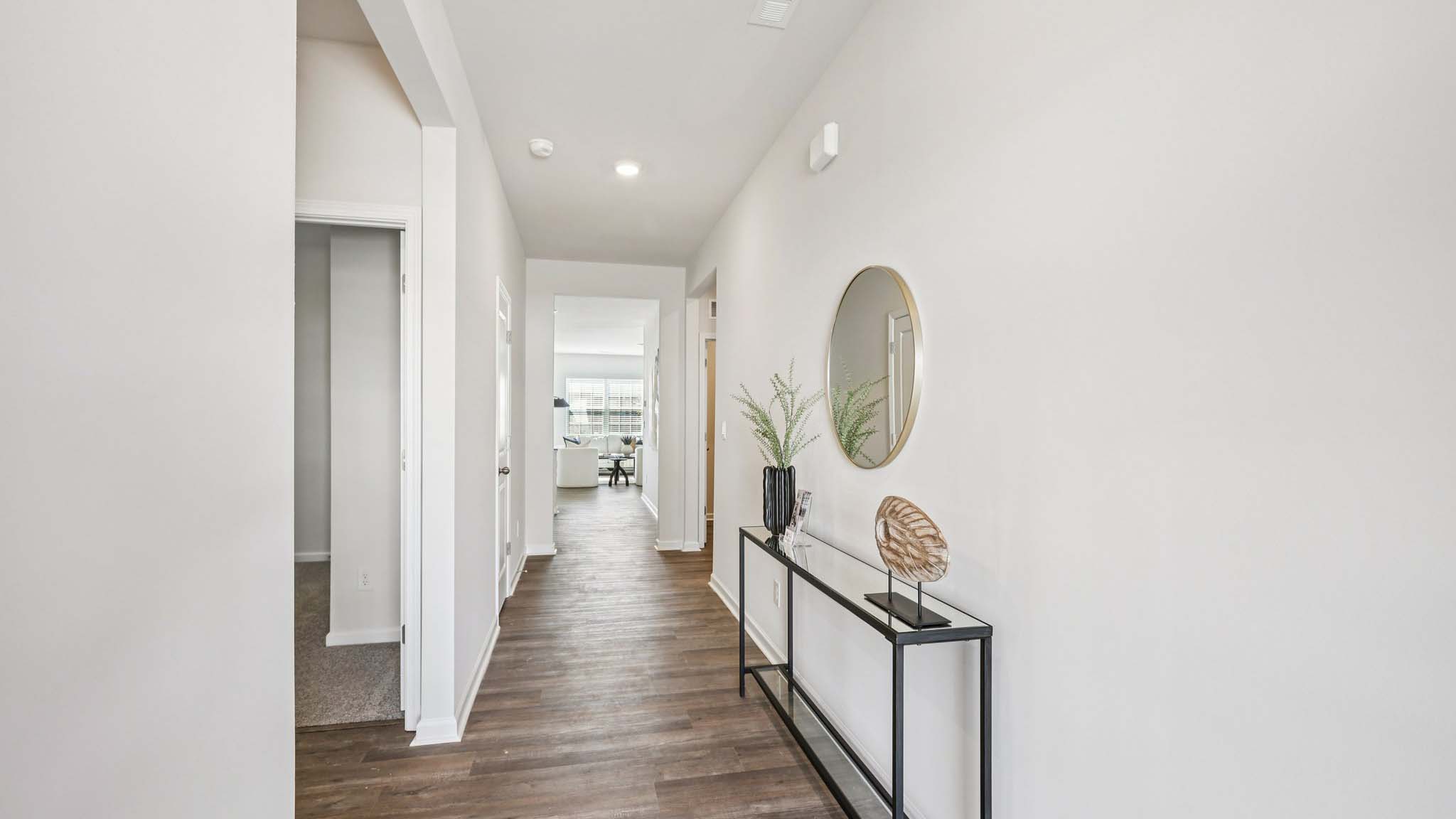 Welcoming foyer with wood floors
