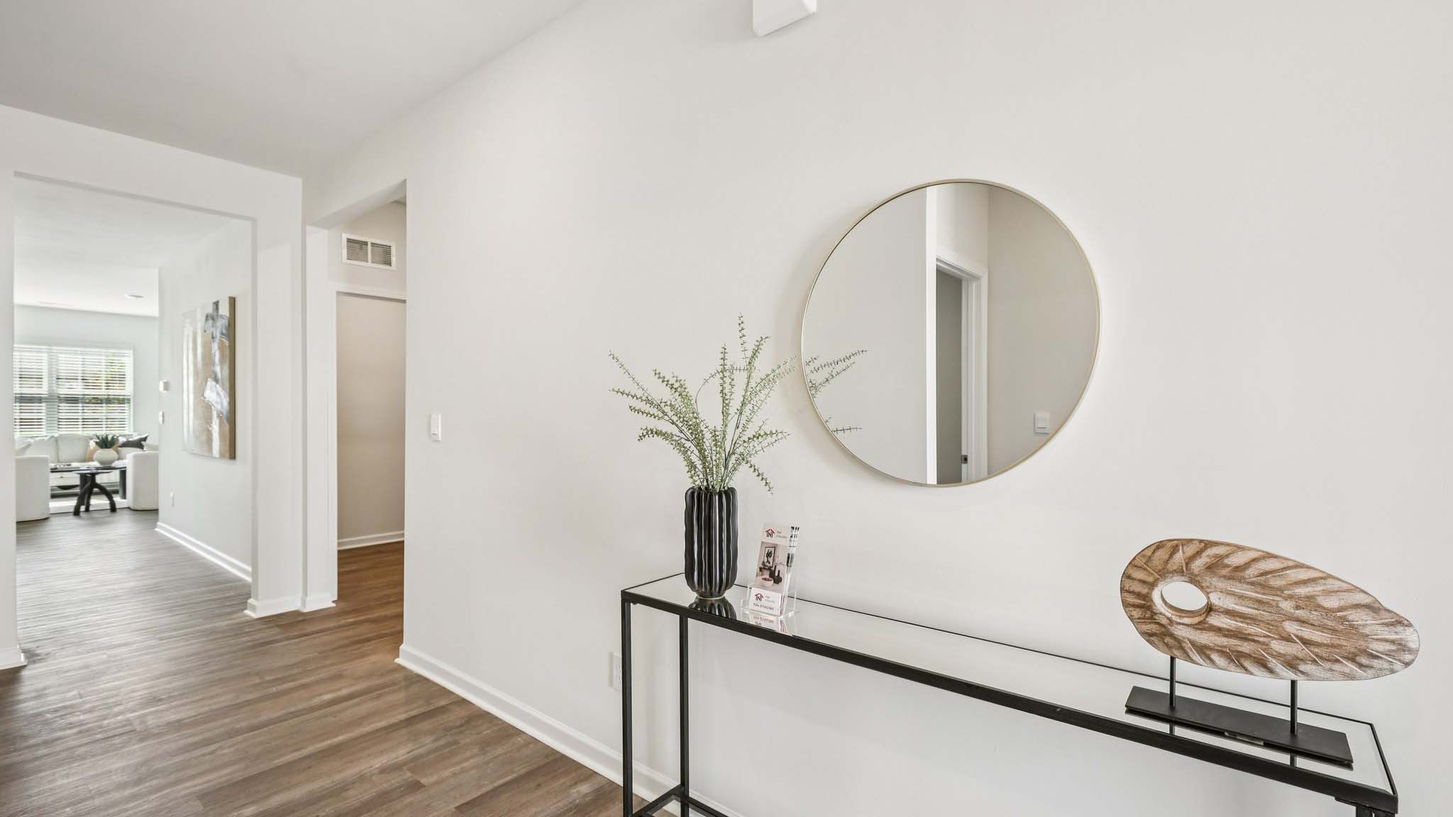 Welcoming foyer with wood floors