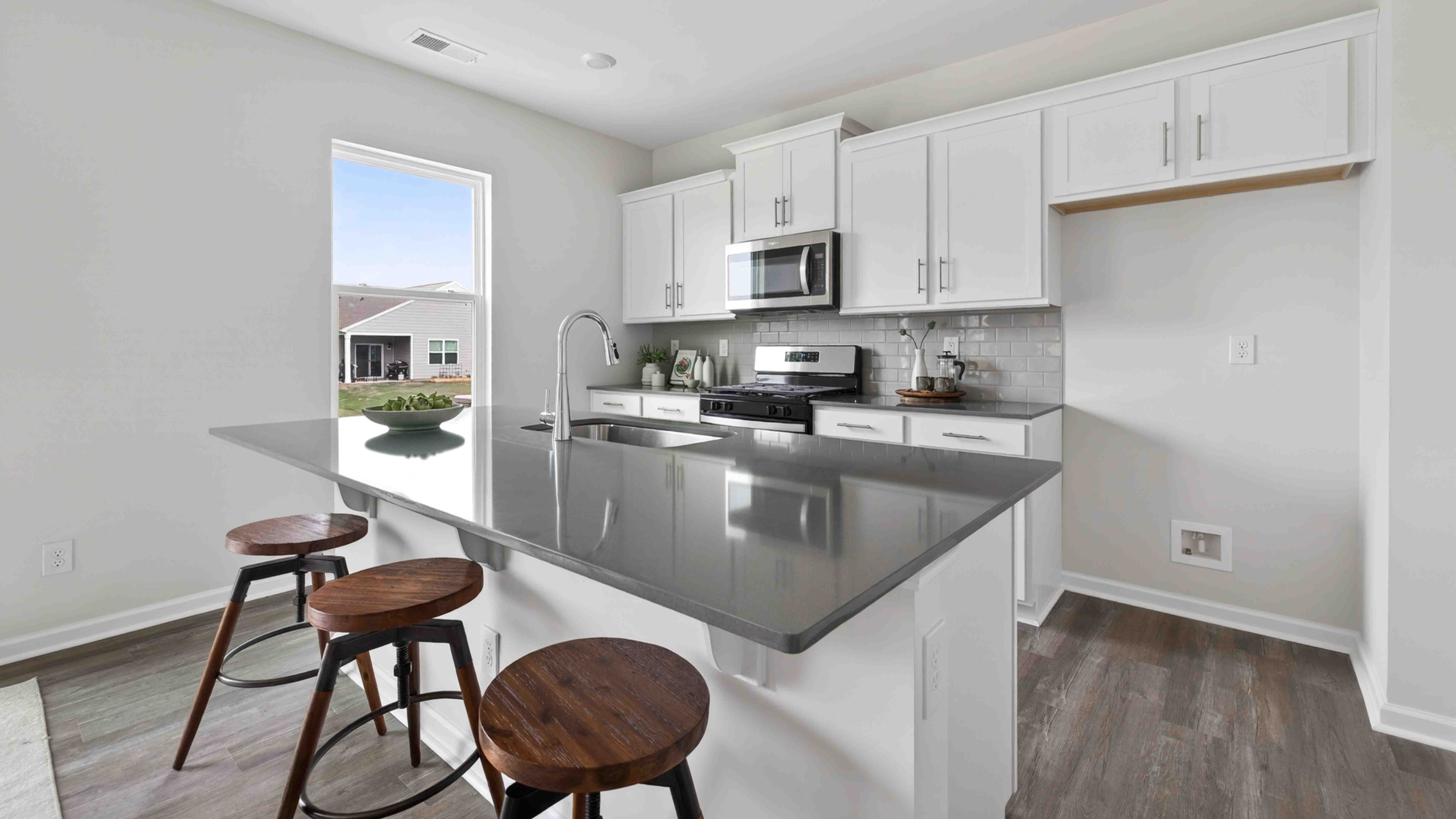 kitchen and island with stainless steel appliances