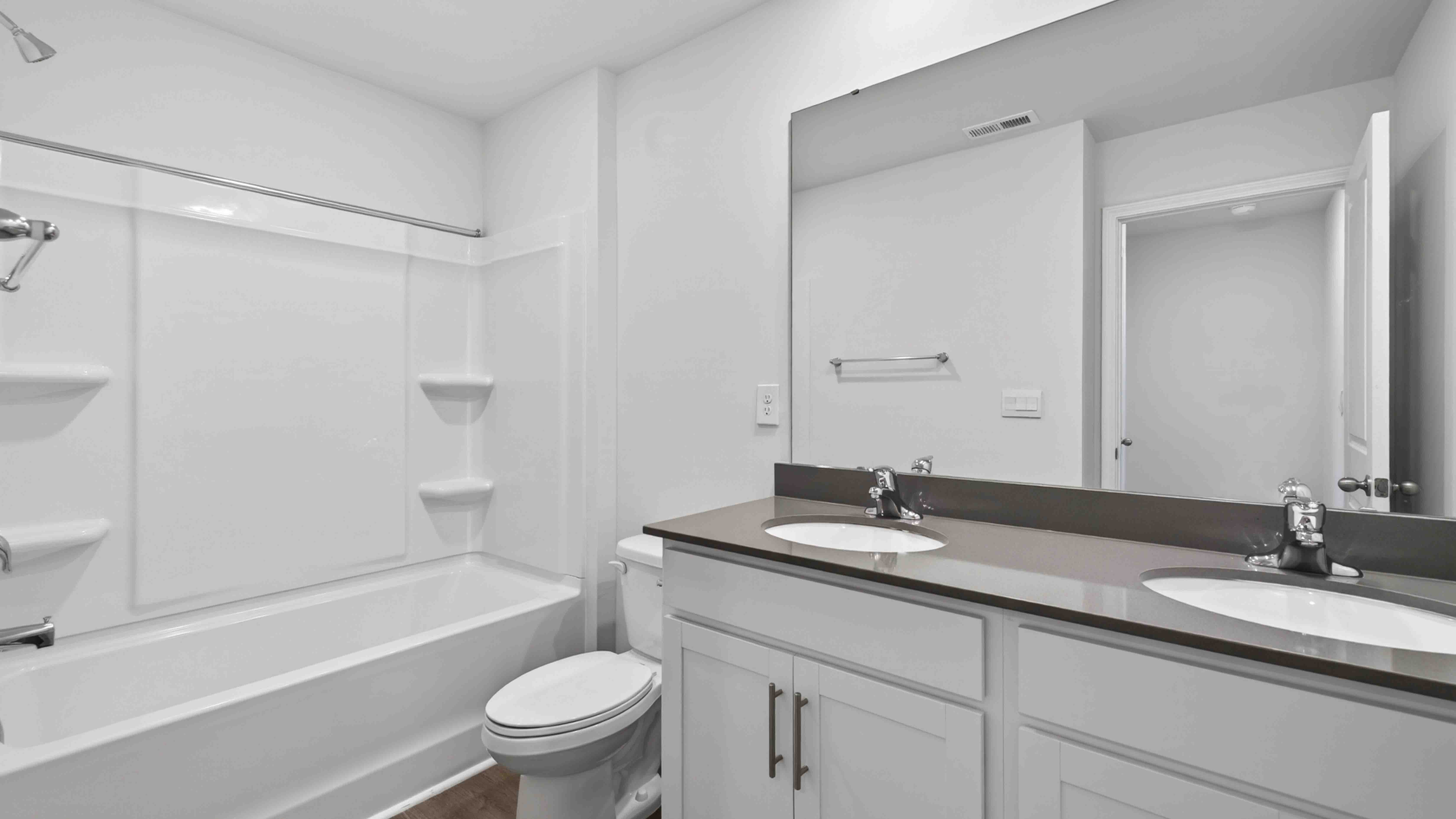 bathroom with double sinks