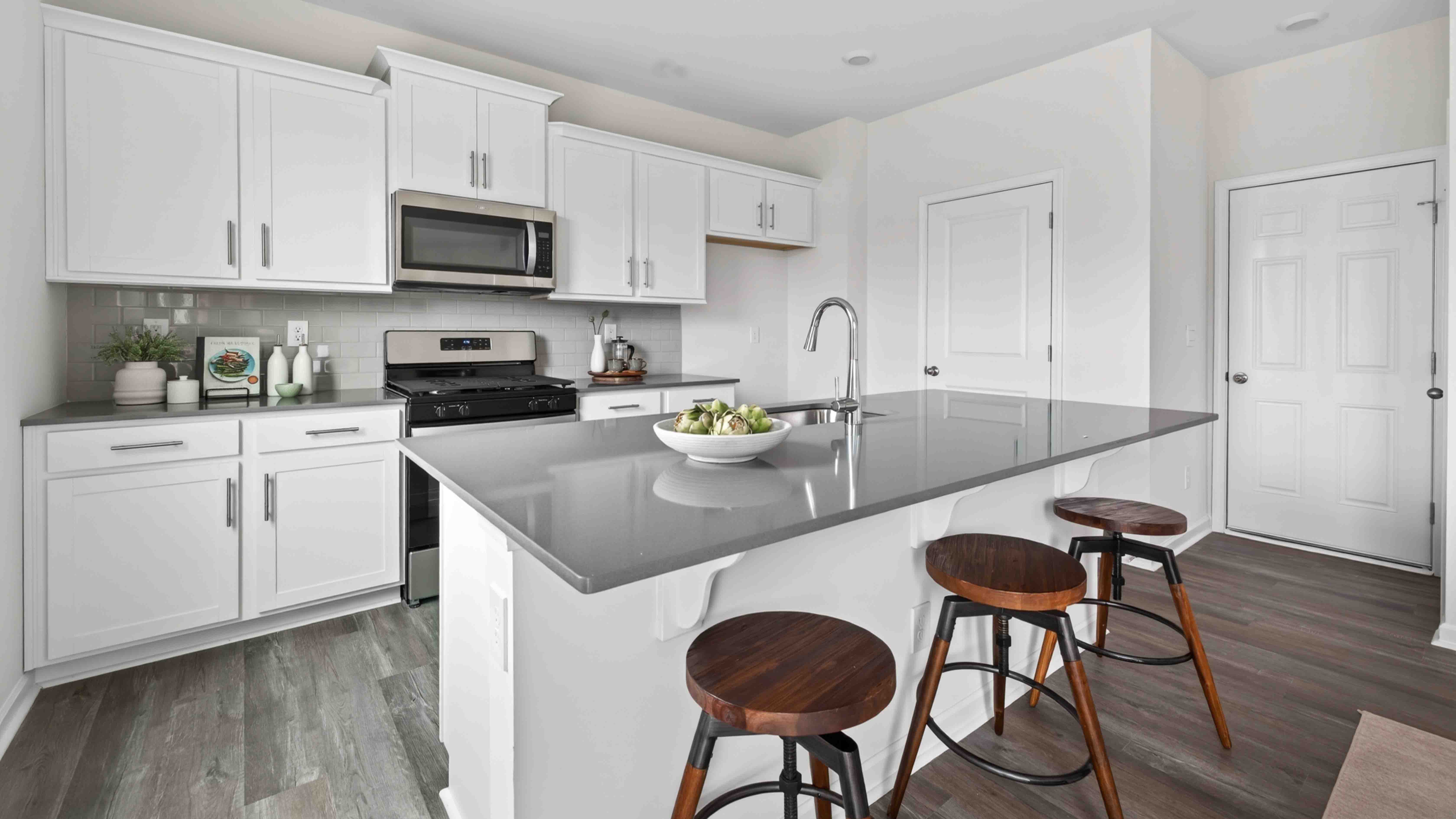 kitchen and island with stainless steel appliances