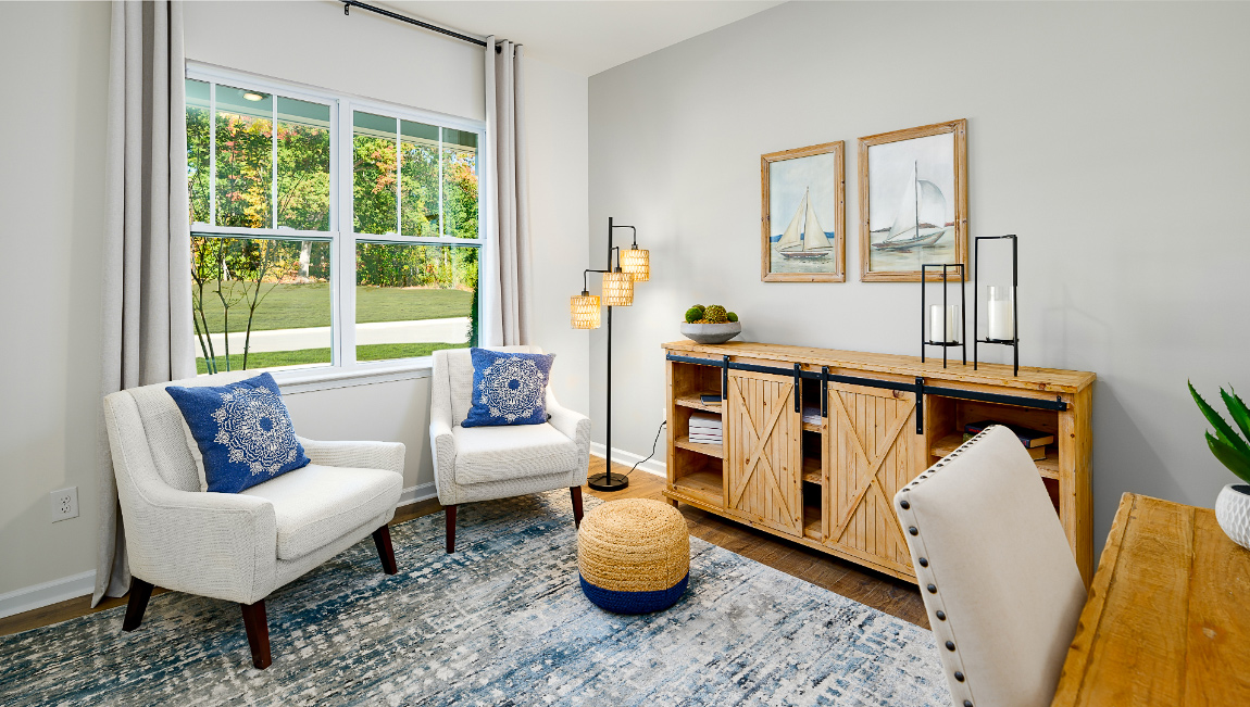 office space with wood floors and large window