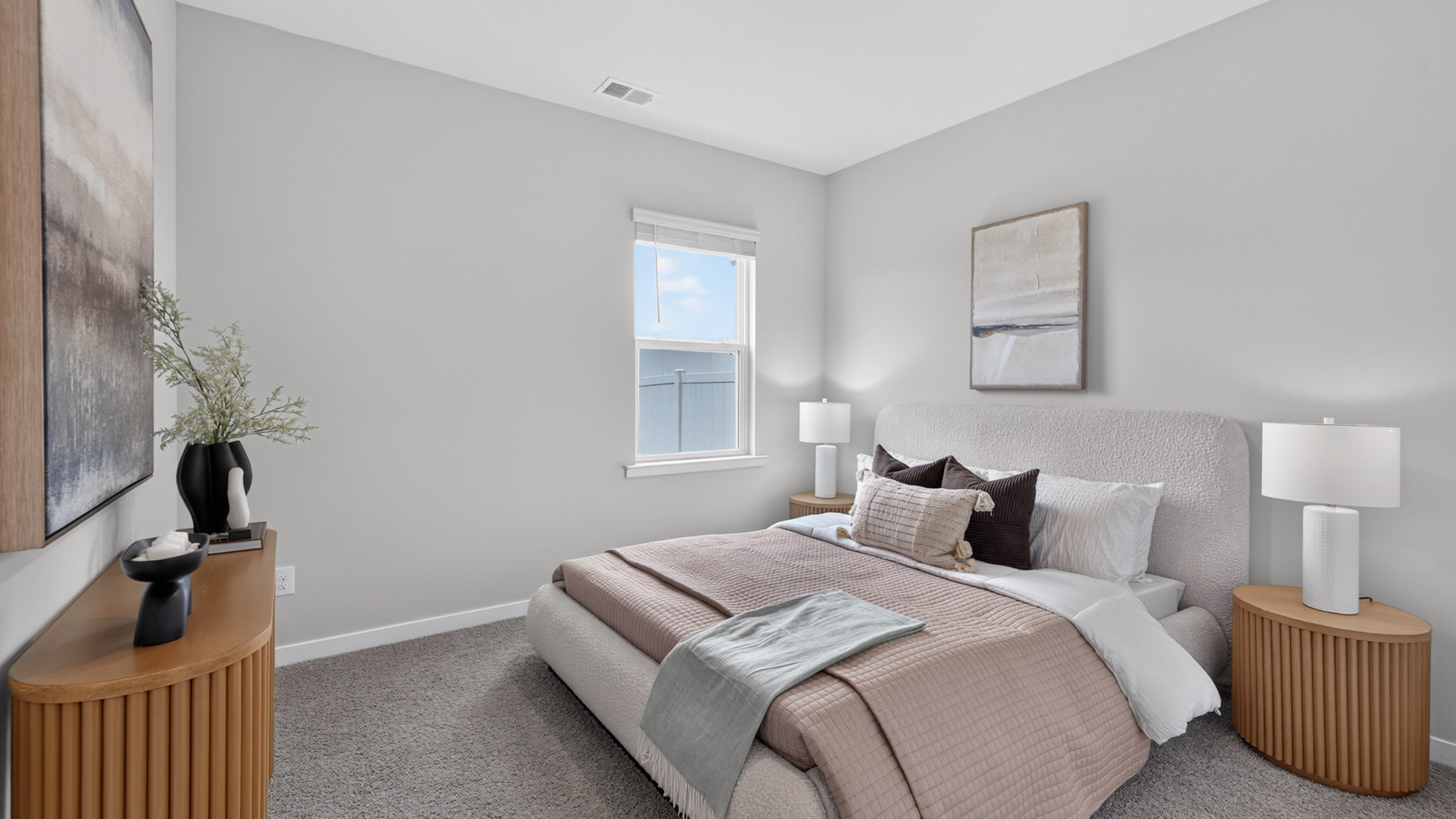 carpeted bedroom with large window