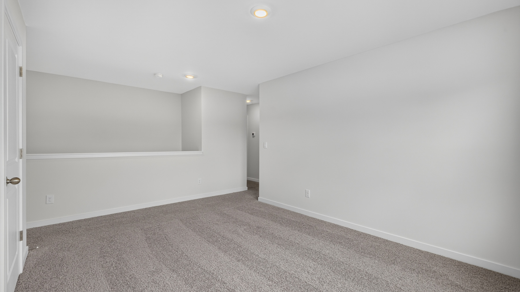carpeted upstairs loft