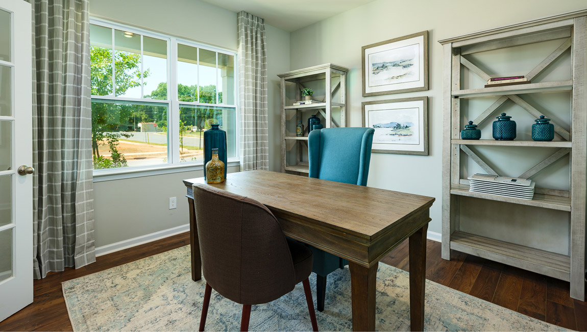 Model laundry room with rack above machines