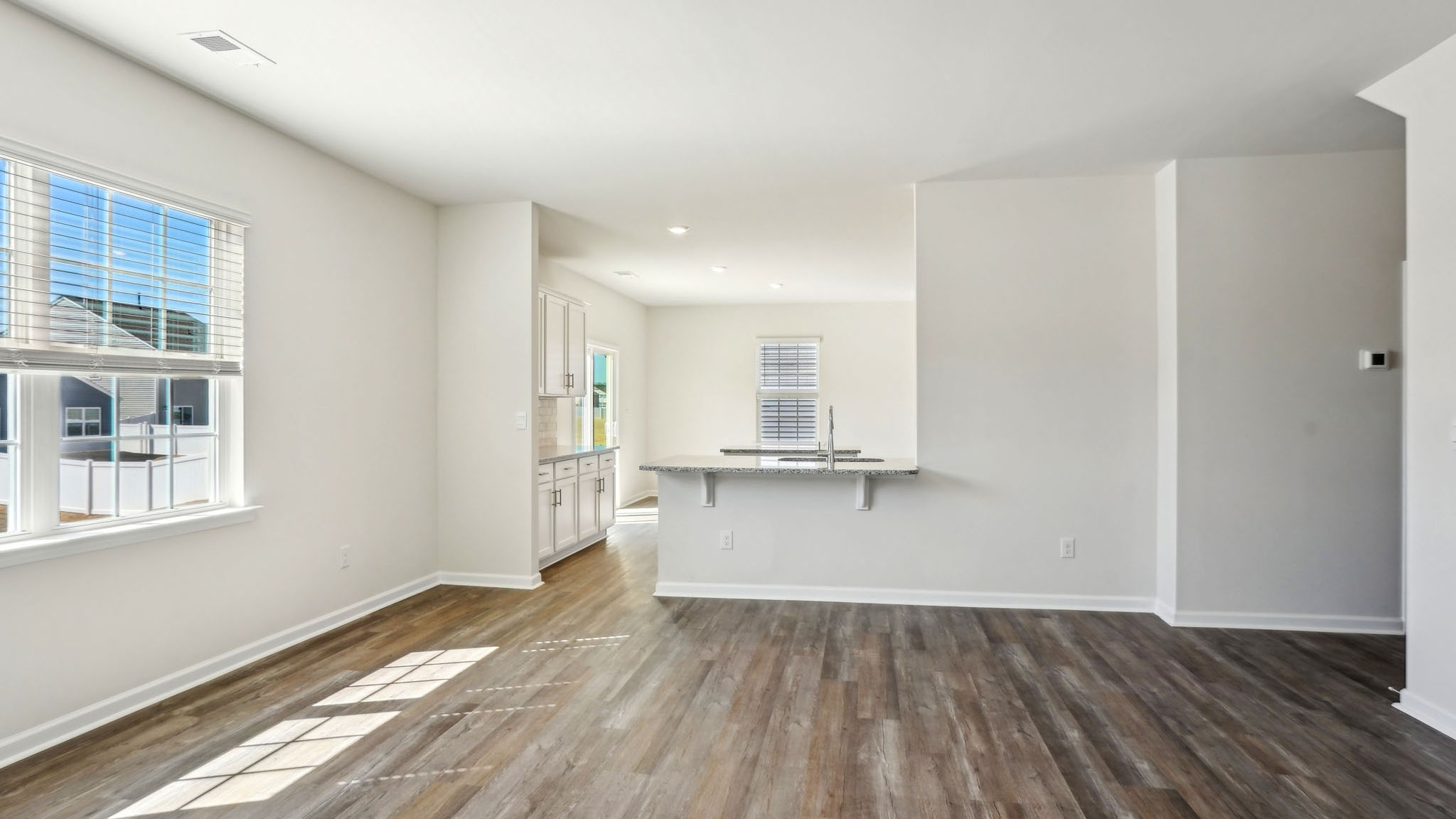Open family room with windows and fireplace