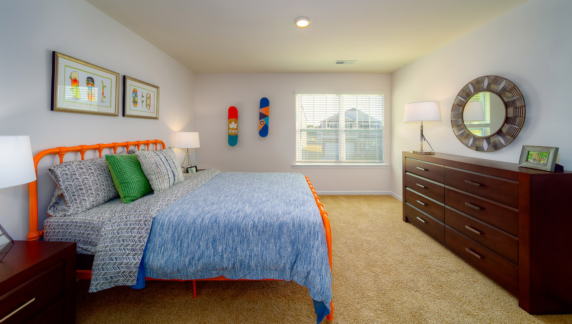 Carpeted bedroom with large window