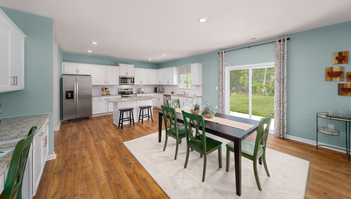 Breakfast area near kitchen, sliding glass doors to patio