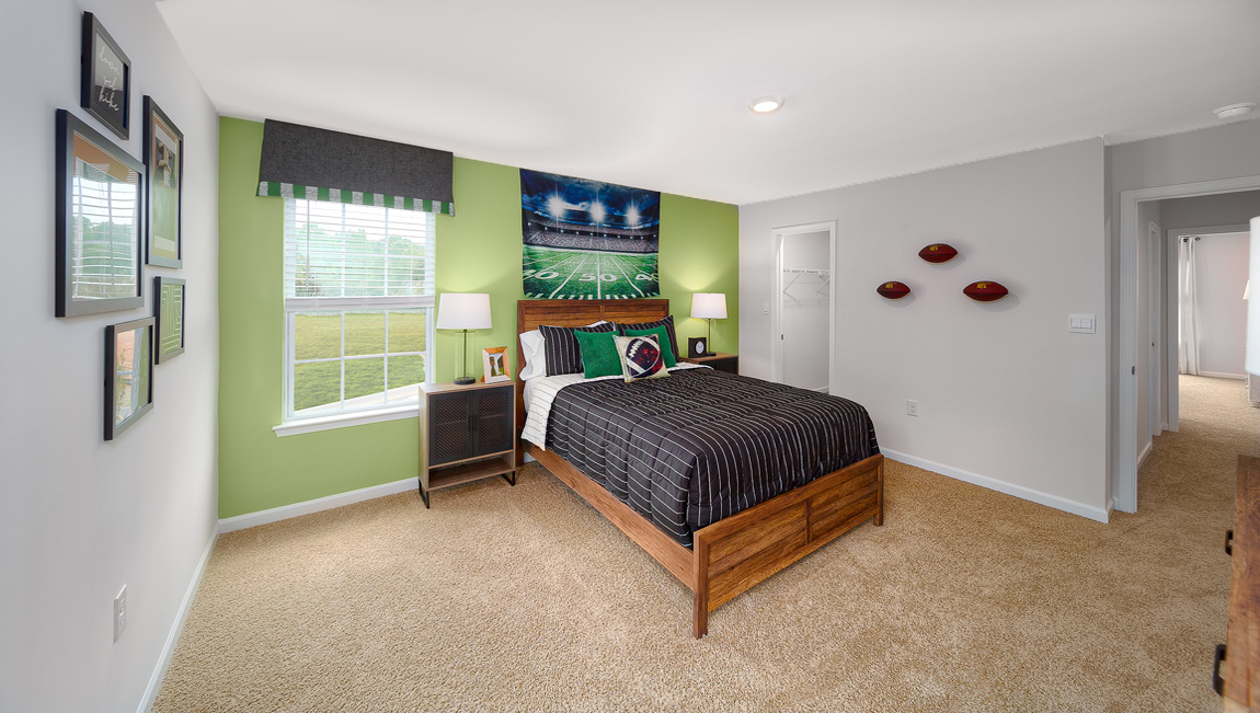 Carpeted bedroom with two large windows