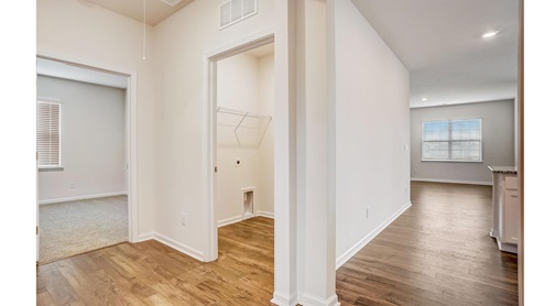 hallway to kitchen, laundry room, and bedroom