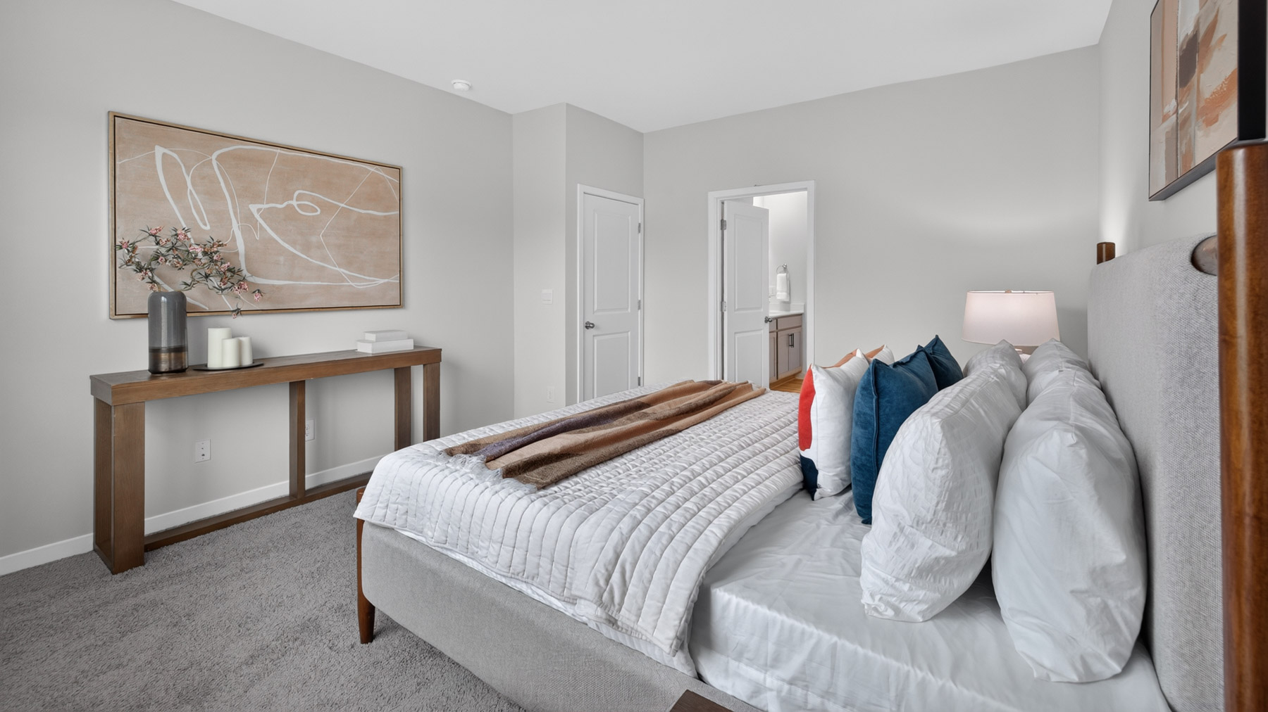 Primary bedroom with carpet and large windowsPrimary bedroom with carpet and large windows