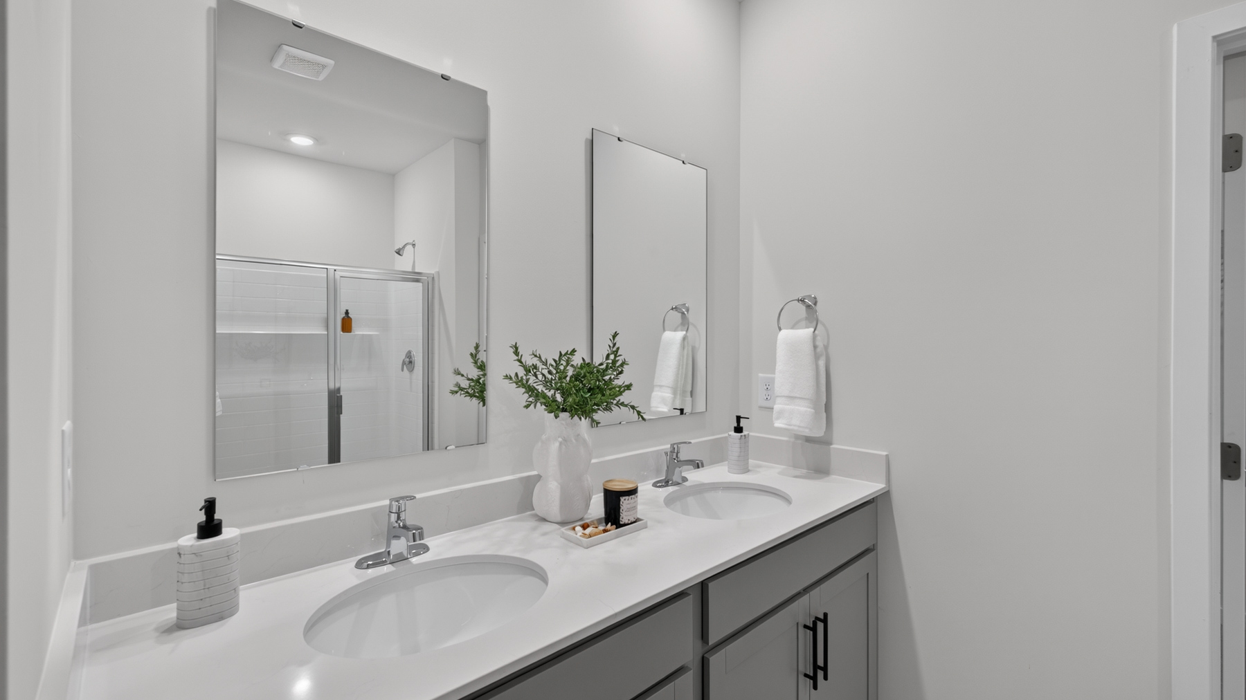 Primary bathroom with bathtub and standing glass door shower