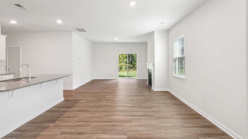 Living room space with windows and fireplace