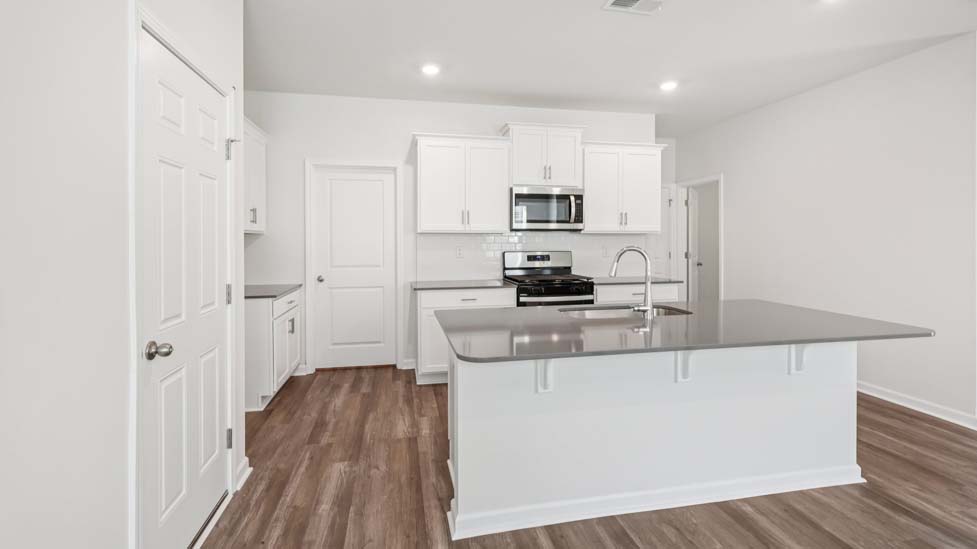 Kitchen and island with stainless steel applainces