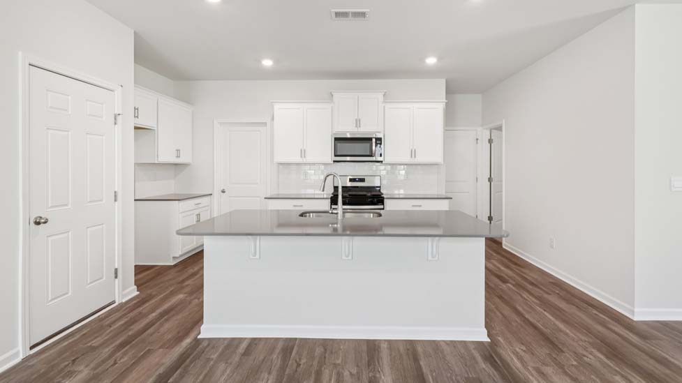Kitchen and island with stainless steel applainces