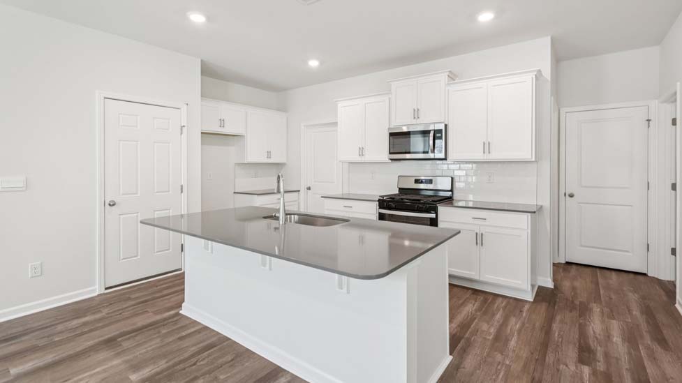 Kitchen and island with stainless steel applainces