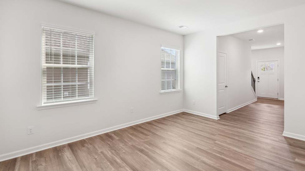 Living room space with windows and fireplace