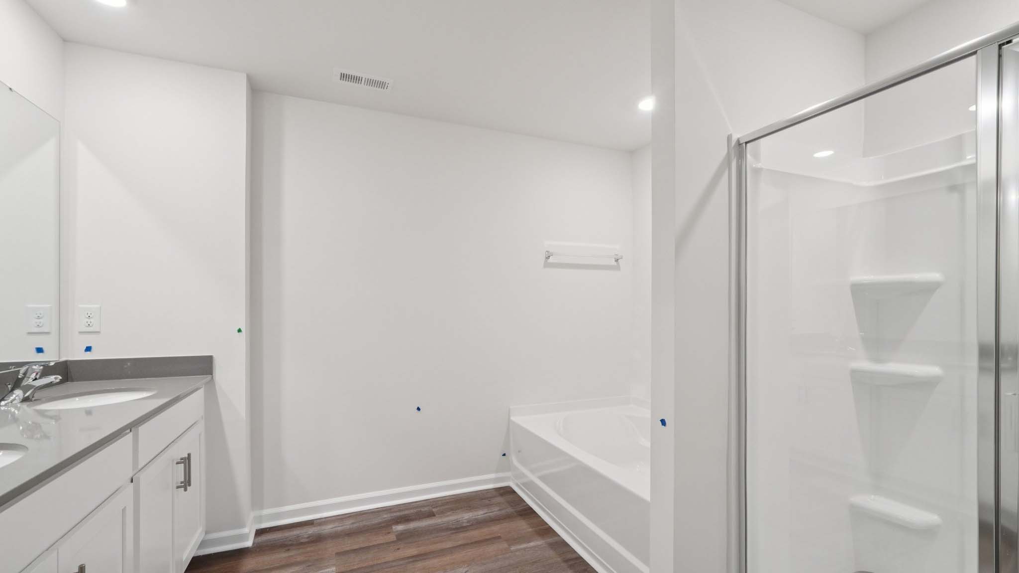 Primary bathroom with standing glass shower