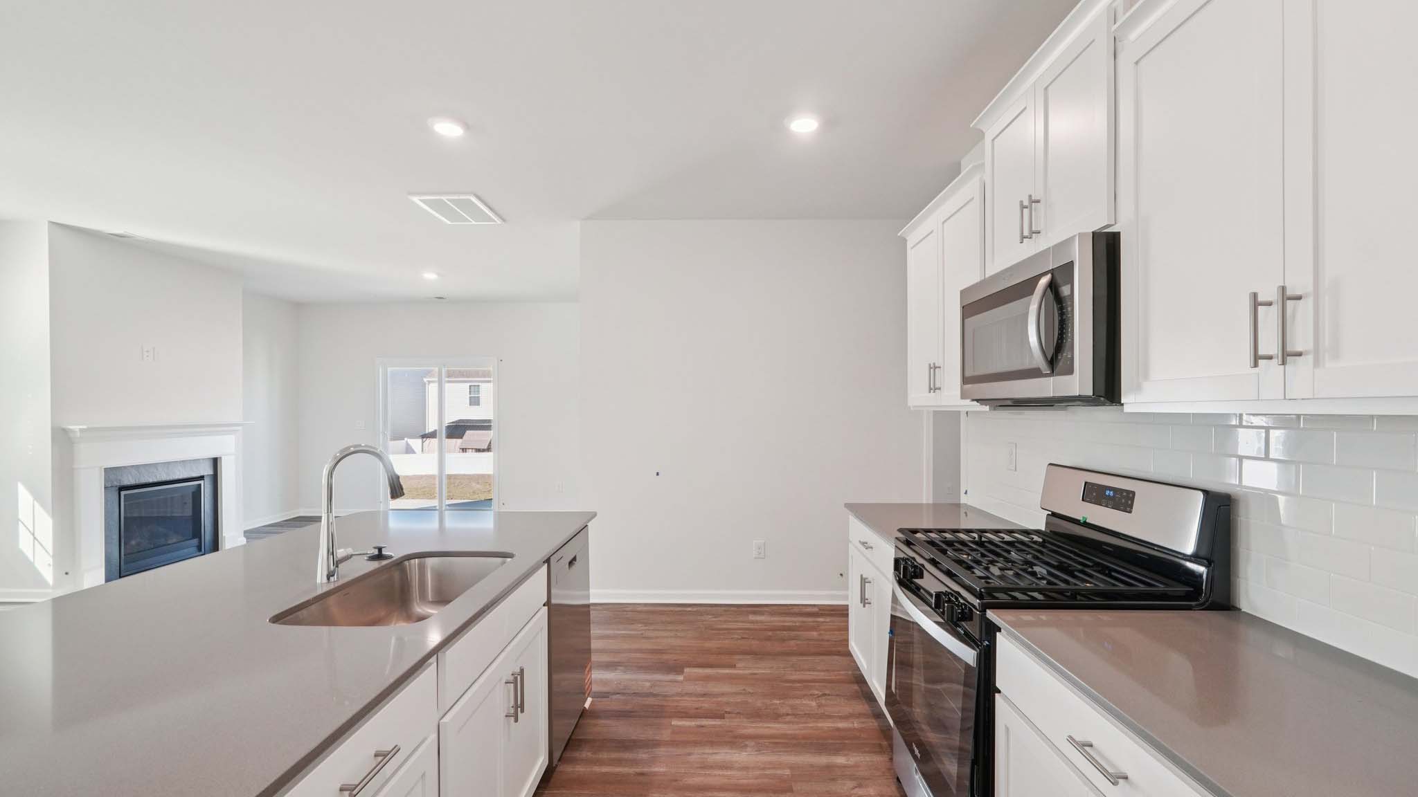 Kitchen and island with stainless steel applainces