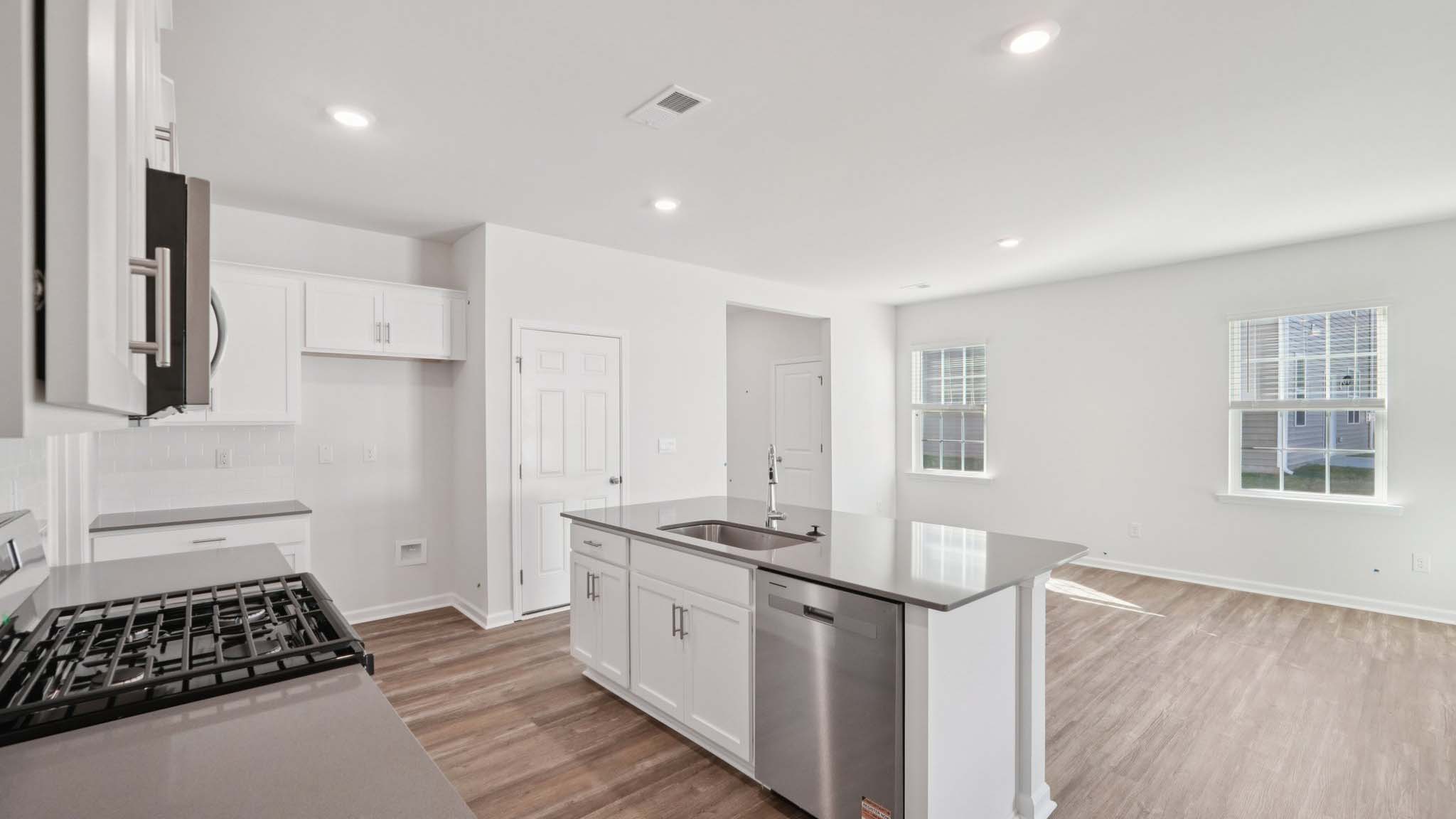 Kitchen and island with stainless steel applainces