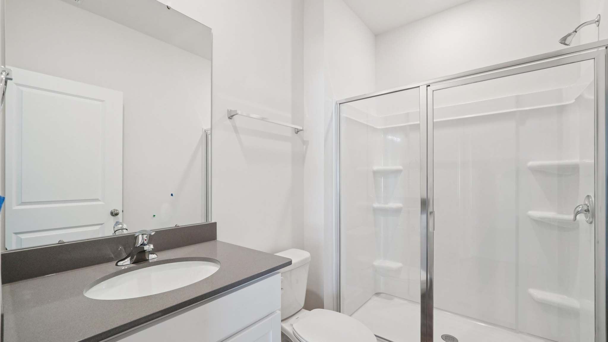 bathroom with standing glass shower