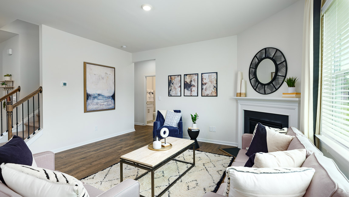 Open family room with windows and fireplace
