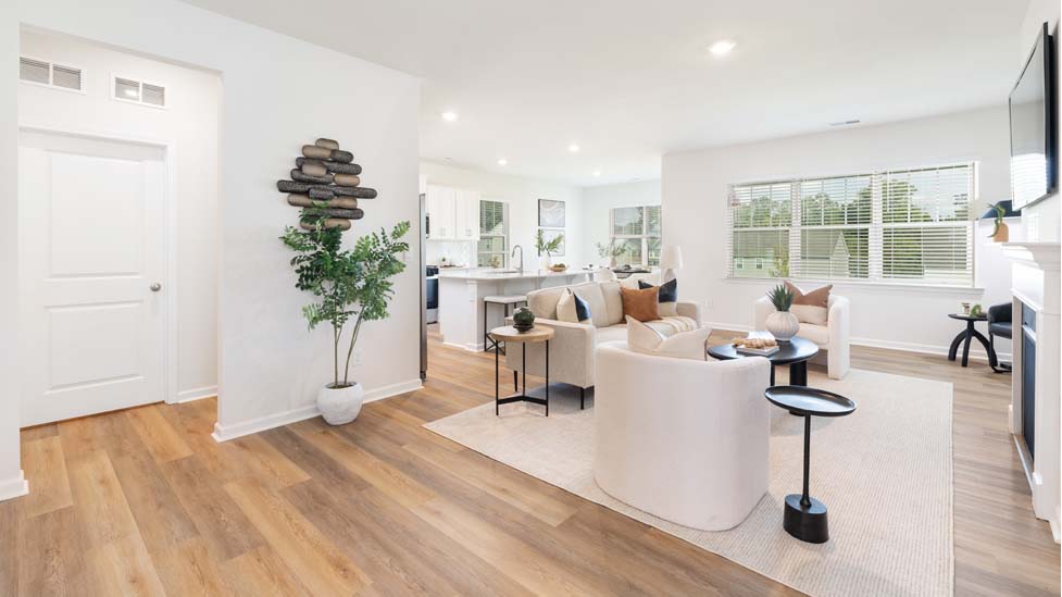 Open family room with large windows, and fireplace