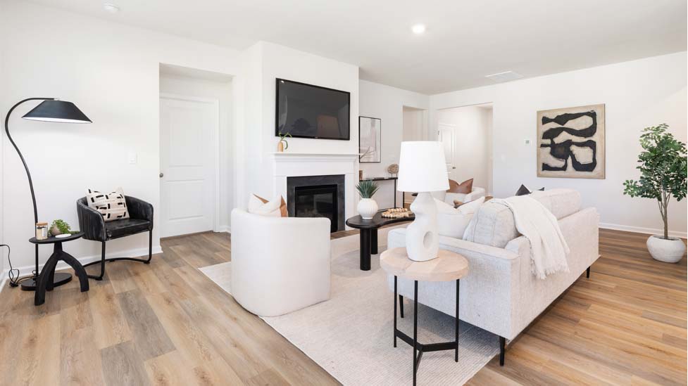 Open family room with large windows, and fireplace