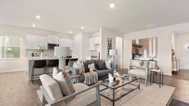 Open family room with large windows, and fireplace